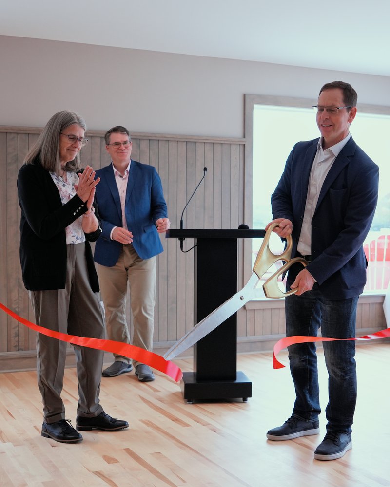 Geoff Bennett cuts the ceremonial ribbon with Debbie Windsor and Anthony Archibald looking on